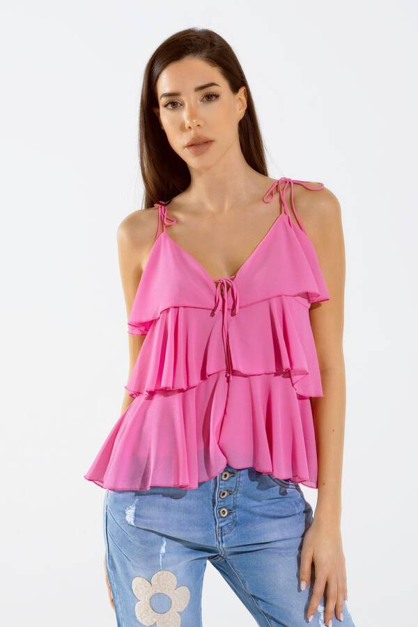 Top de volantes con tirantes finos en fucsia